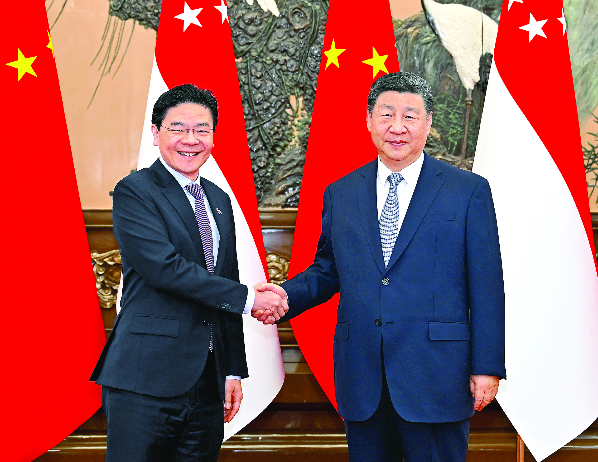     6月24日上午，国家主席习近平在北京人民大会堂会见来华进行正式访问的新加坡总理黄循财。新华社发